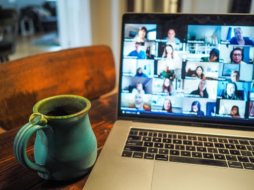 Laptop with virtual classroom, with coffee mug