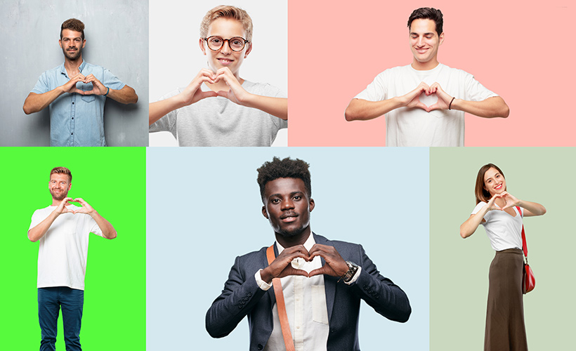 Professionals making the "heart hands" gesture