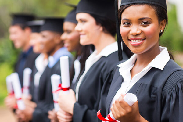 Career-ready students at graduation with diplomas