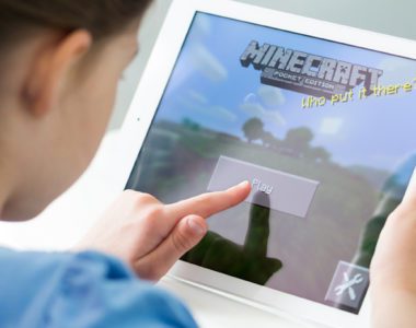 Young student playing Minecraft
