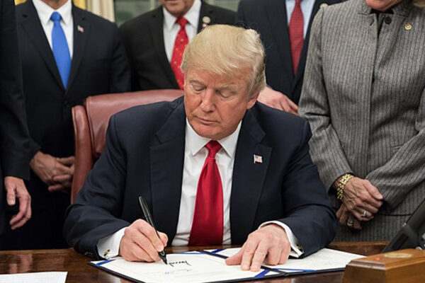 Donald Trump signing a bill, 2018