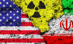 U.S. and Iranian flag fragments with a nuclear symbol between them, representing the Iran Nuclear Program