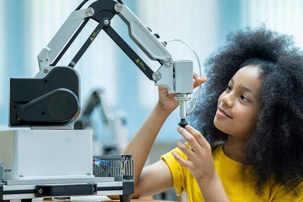 STEM student examining a device used for research