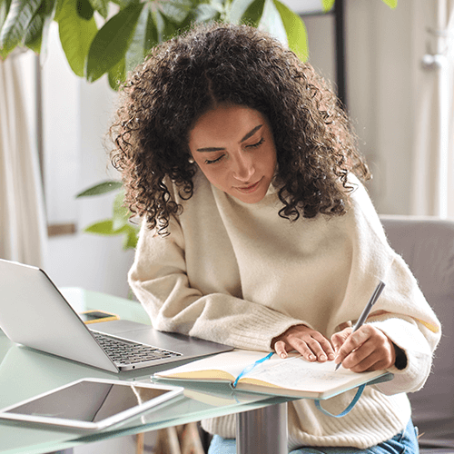 Woman writing in a notebook