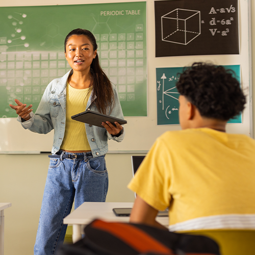 Student standing in front of class talking
