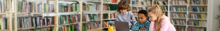 Kids looking at laptop