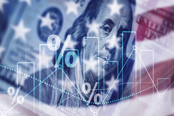 Bar graph and image of $100 bill superimposed over an American flag